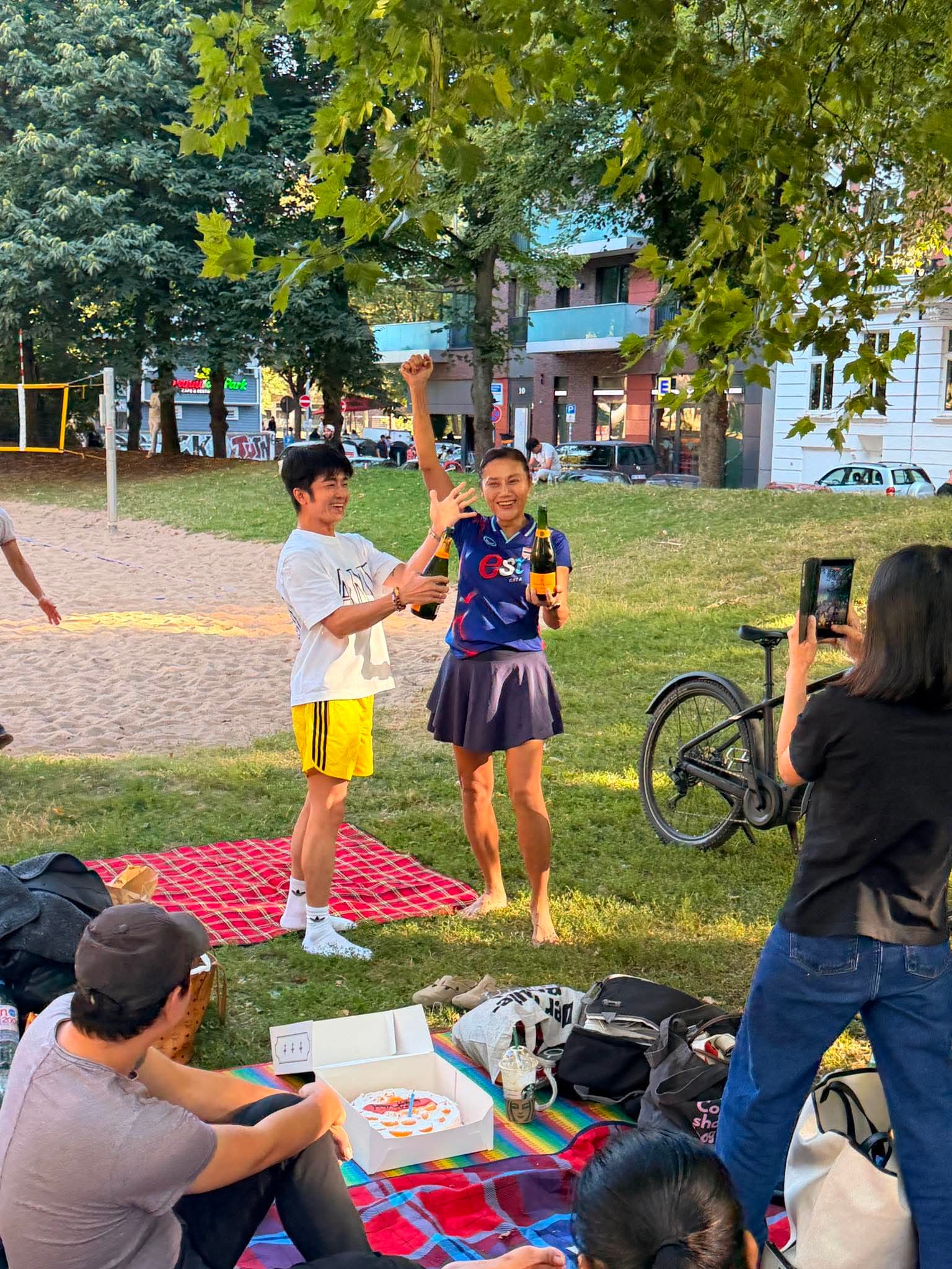 Friends celebrating a birthday together outdoors
