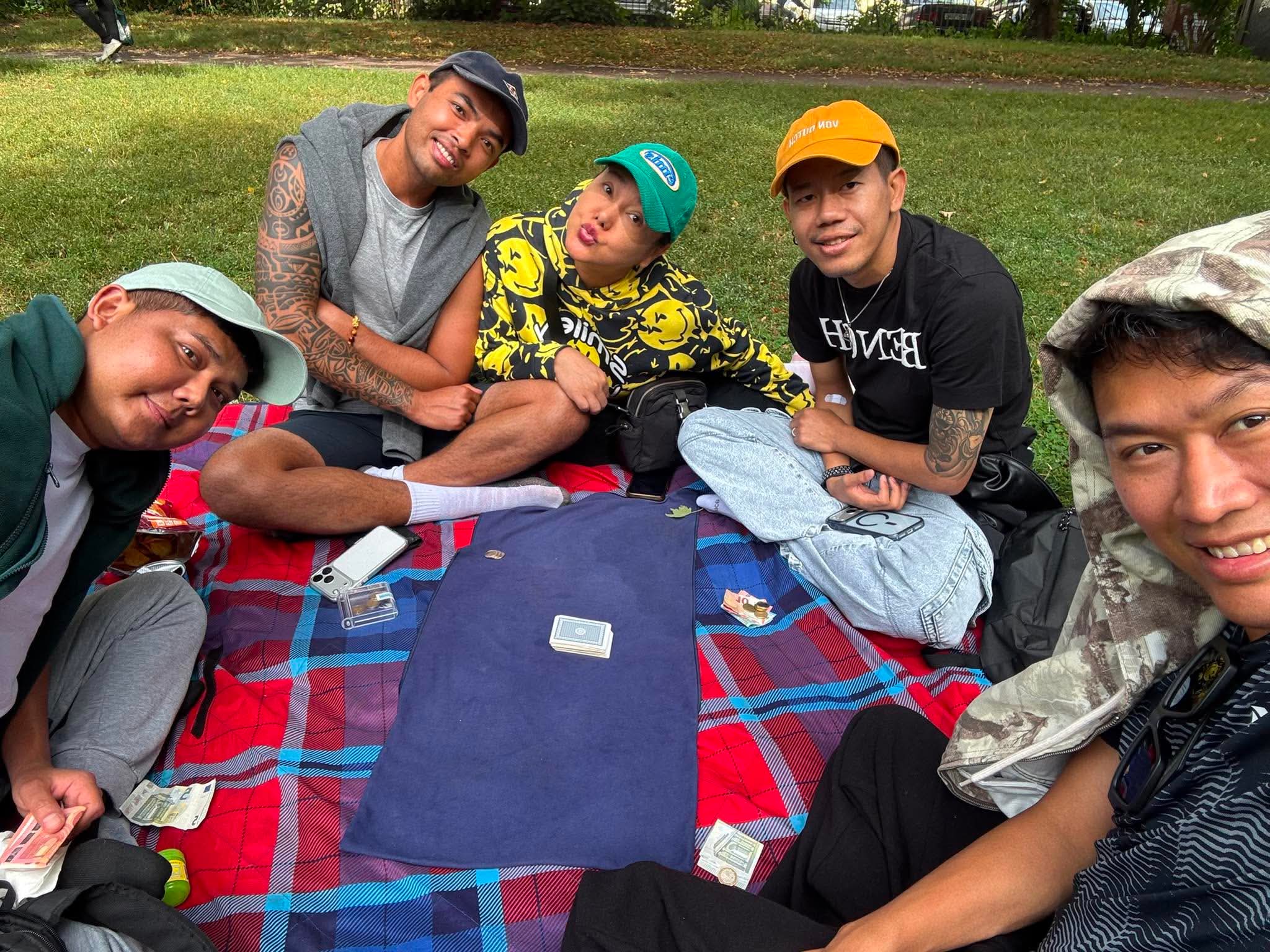 Friends enjoying a picnic together in a Hamburg park